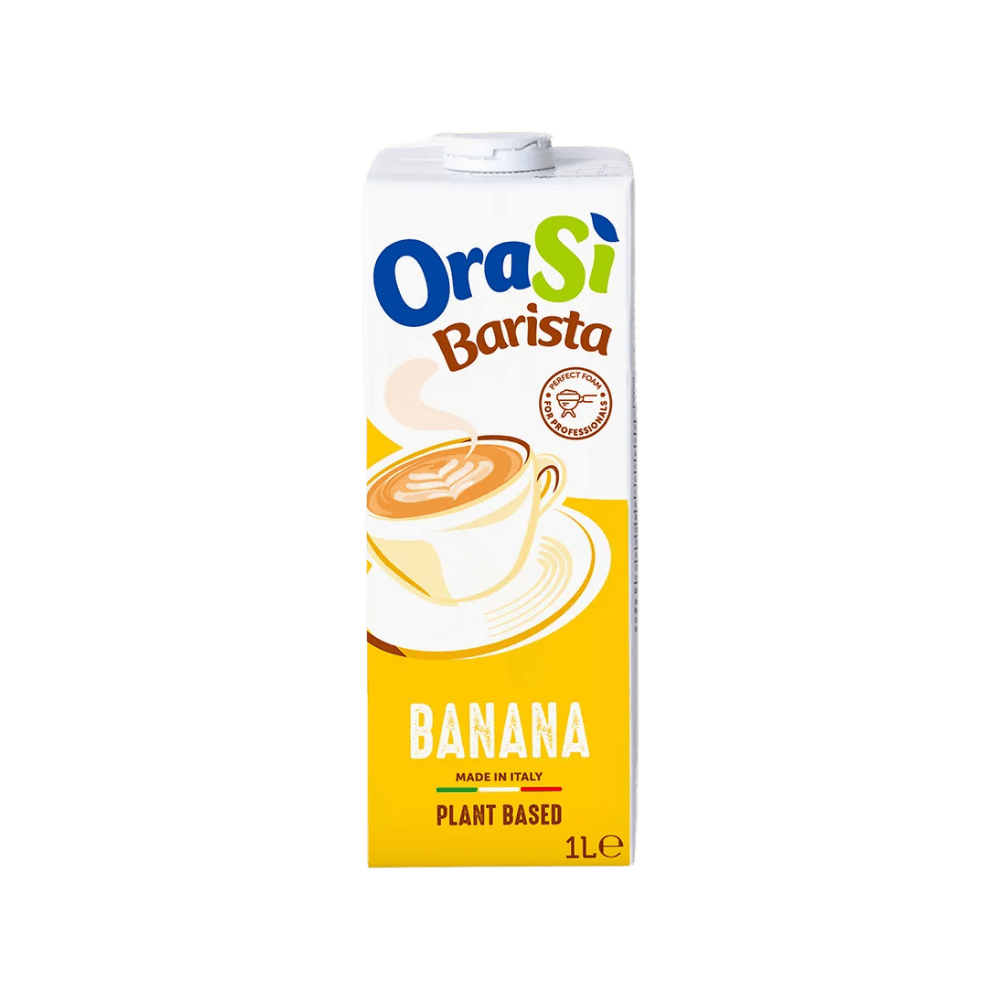 A 1-liter carton of OraSi Barista Banana plant-based milk, featuring a bright yellow design and an illustration of a frothy coffee.
