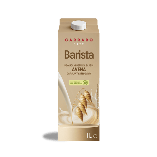 A 1-liter carton of Carraro 1927 Barista Oat plant-based milk, featuring oat stalks splashing into creamy milk.